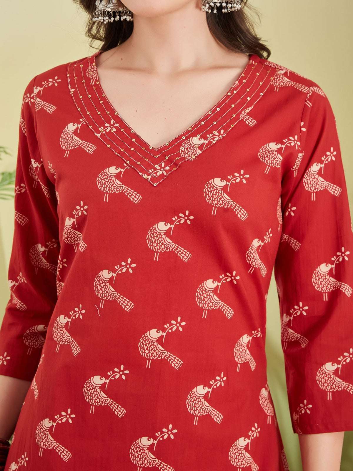 Red Indian ethnic kurta with white bird print and beaded V-neckline