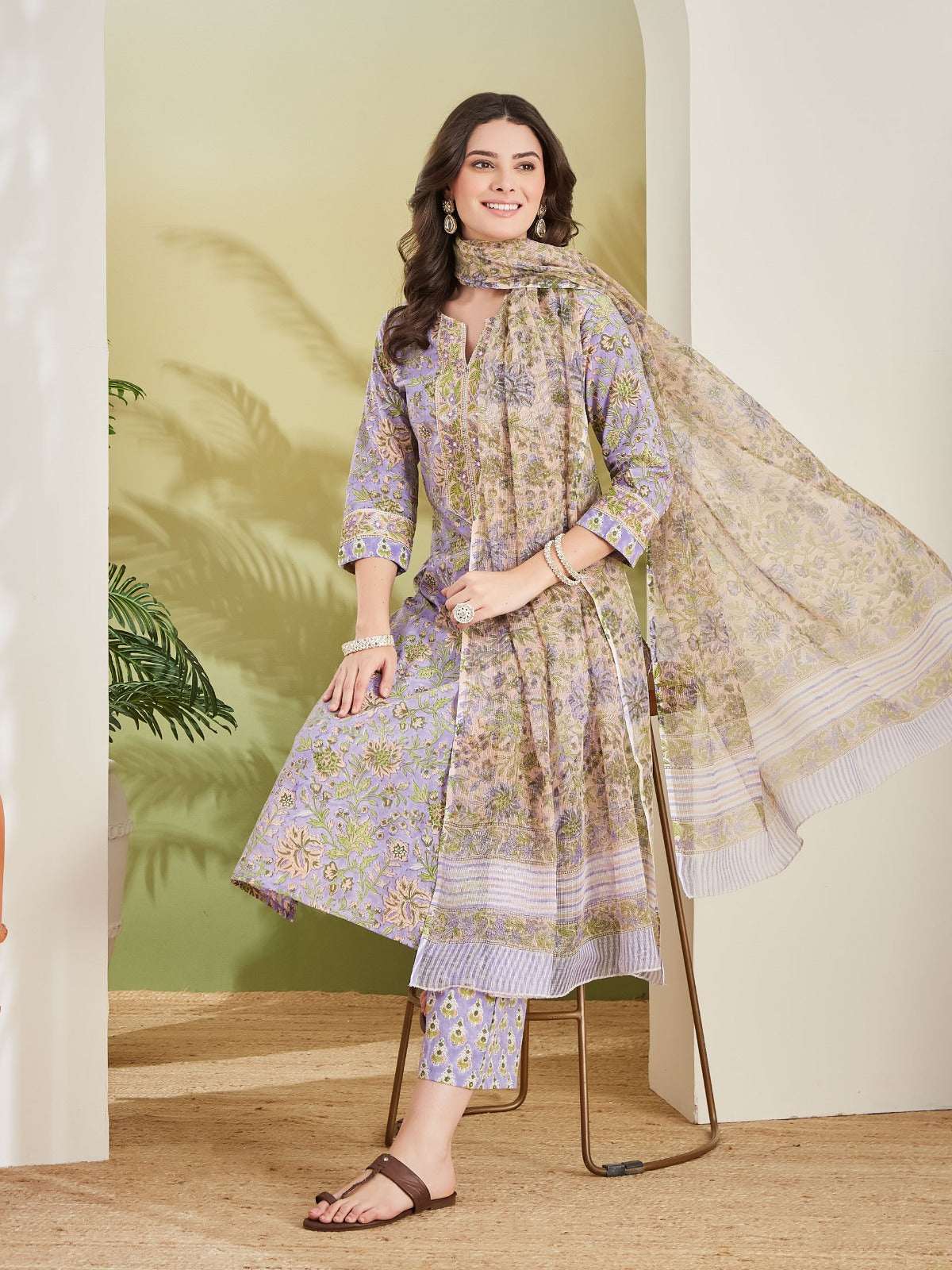 Woman in elegant lavender floral print Indian ethnic salwar kameez set with dupatta