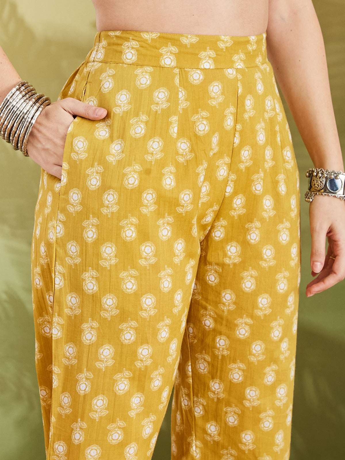 Yellow floral print ethnic cotton trousers with pockets for women.