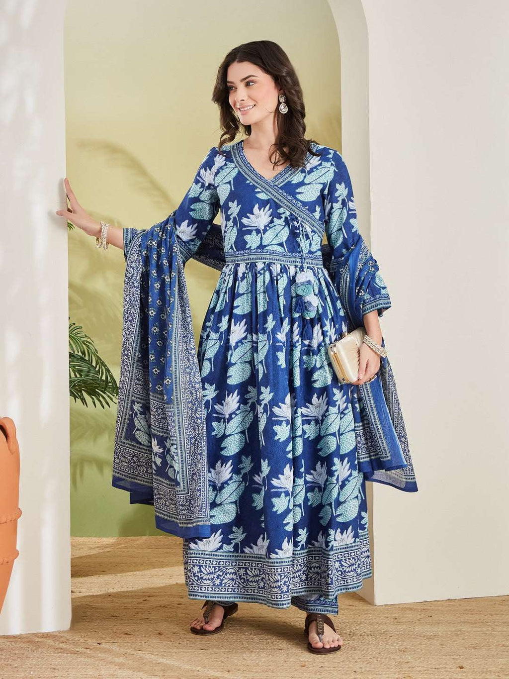 Woman in blue floral print Indian ethnic Anarkali dress with matching dupatta