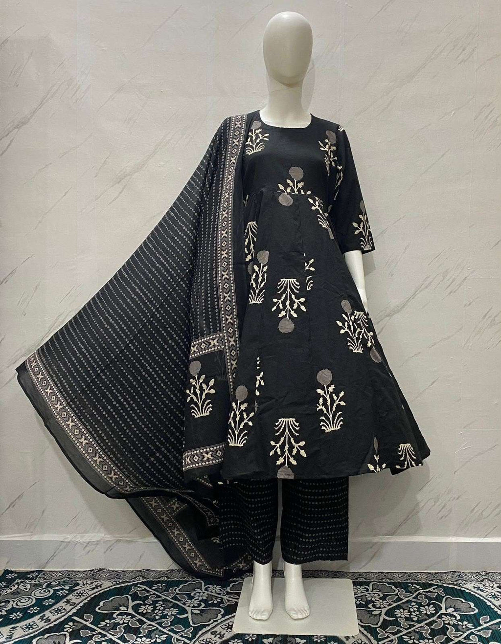 Black ethnic flared kurta set with gold floral print and matching dupatta
