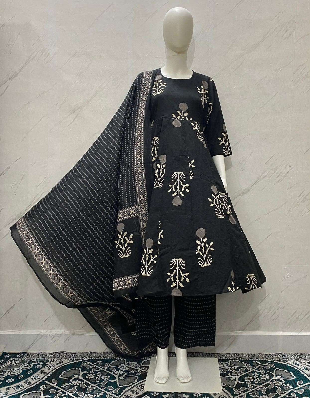 Black ethnic flared kurta set with gold floral print and matching dupatta