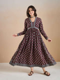 Woman wearing a maroon floral print long ethnic Anarkali dress with long sleeves.