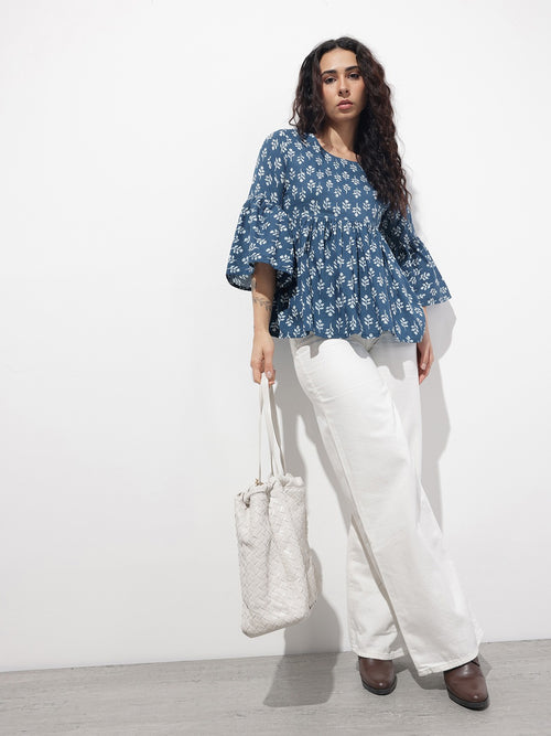 Model wearing Blue Floral Peplum Top