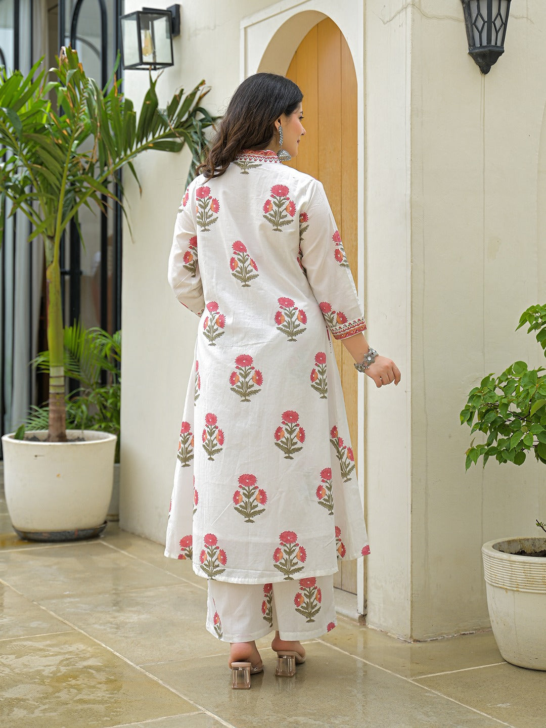 Woman in white floral print cotton ethnic kurta and palazzo set