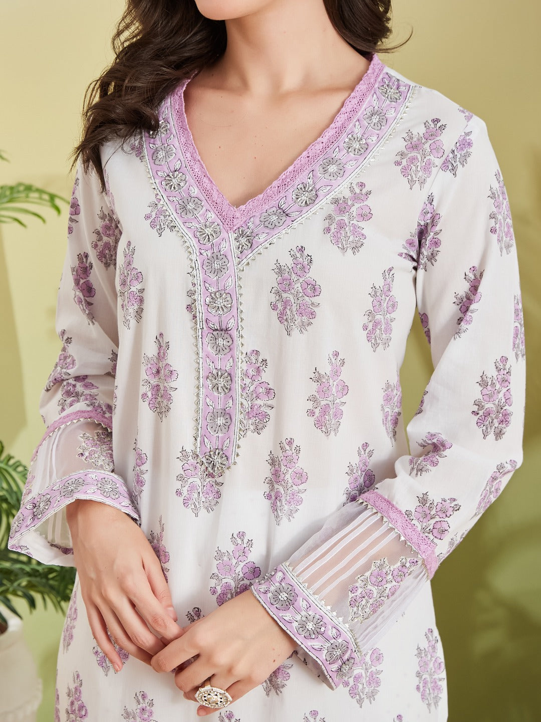 White floral printed kurta with purple lace trim and V-neck design