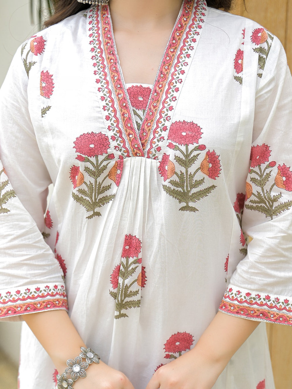 White cotton ethnic kurta with red floral print and embroidered V-neckline