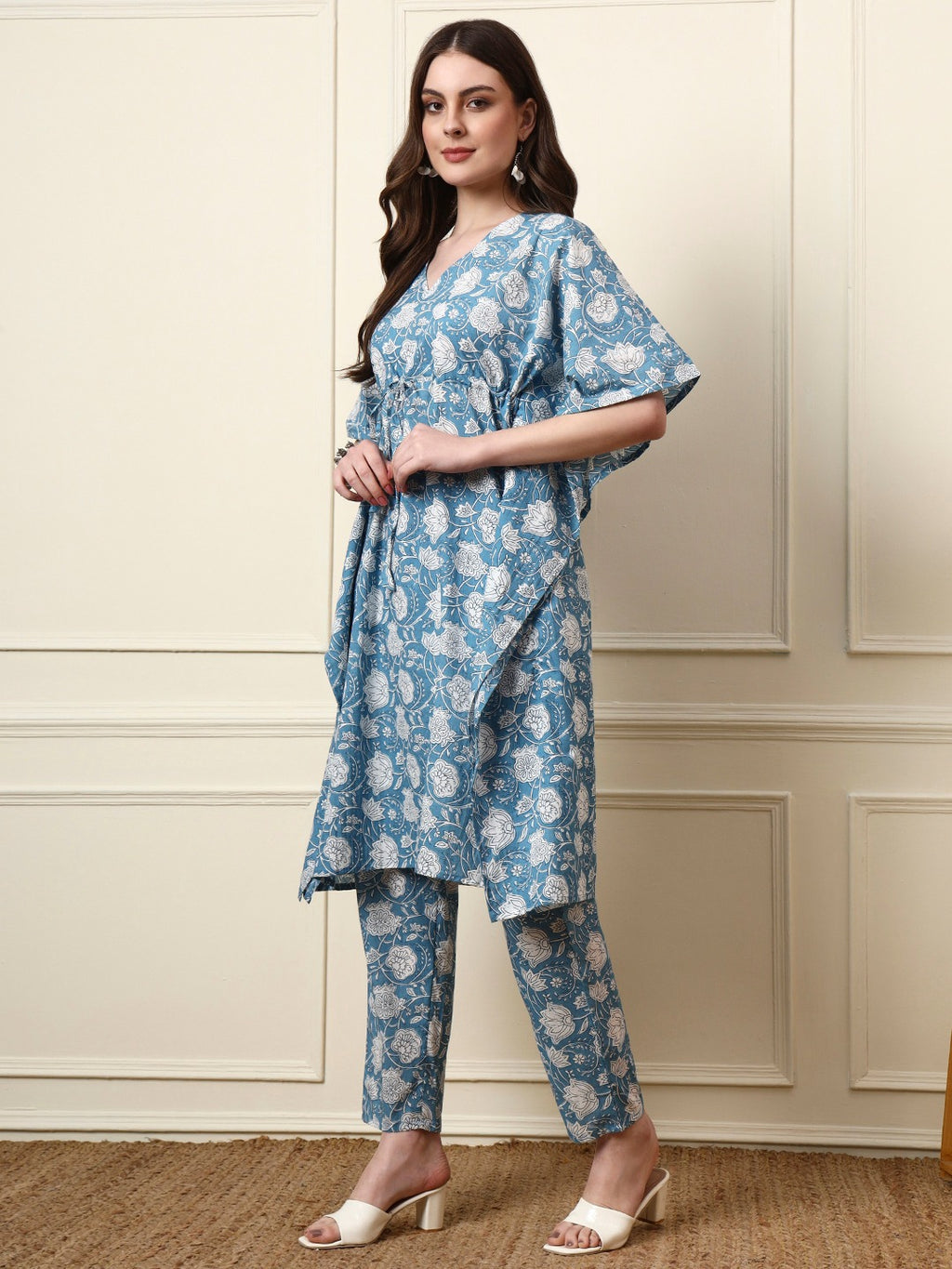 Woman wearing a blue floral printed ethnic tunic and trouser set
