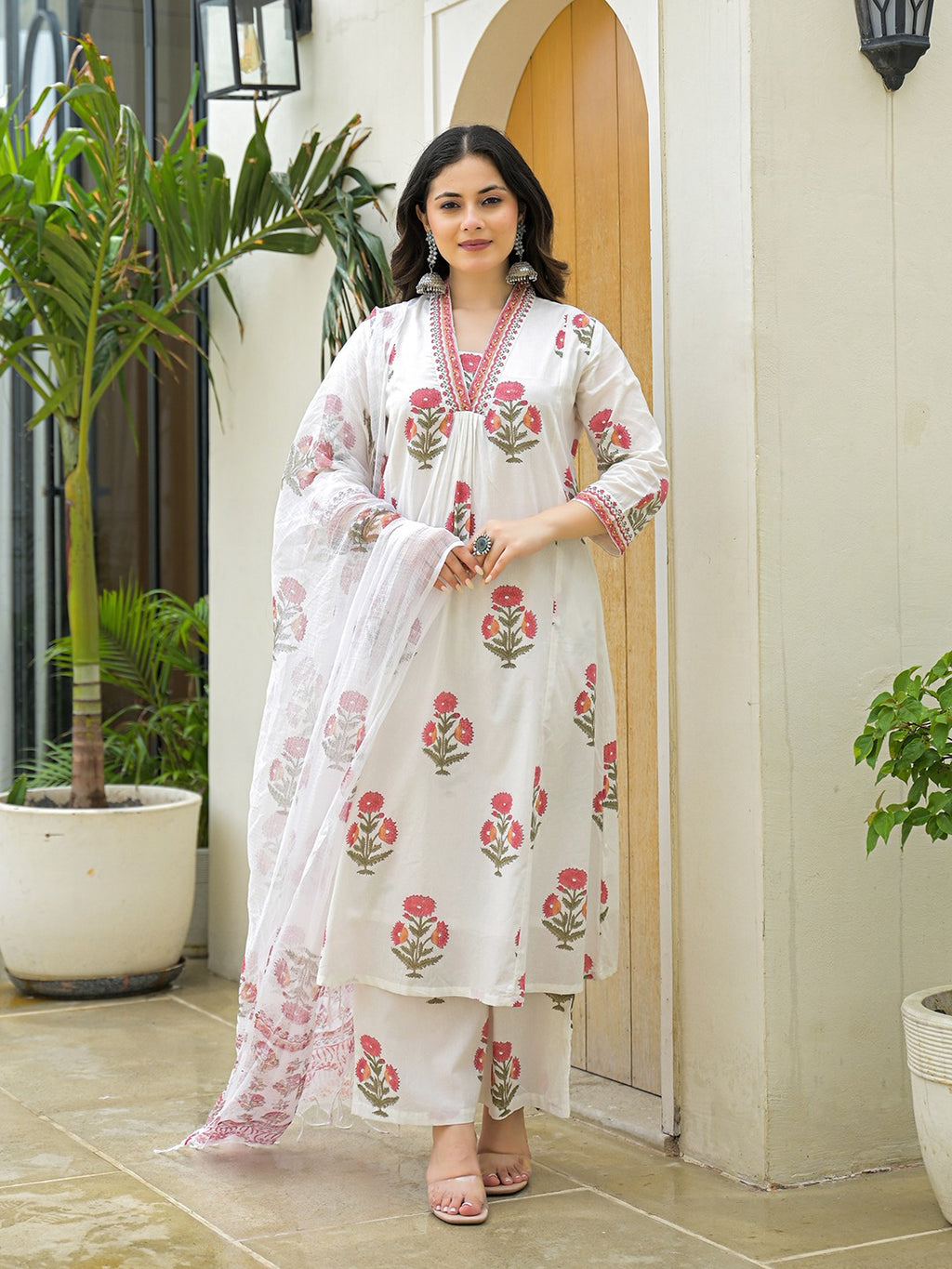 Woman in white floral print Indian ethnic kurta set with dupatta