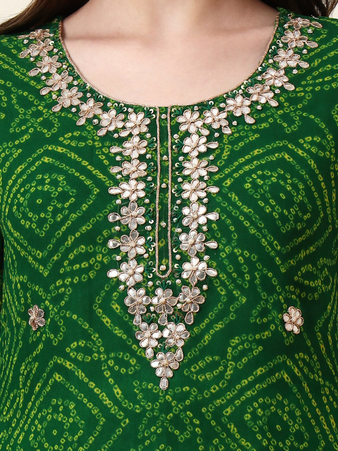 Green Bandhani print ethnic kurta with intricate gold floral embroidery at the neckline.